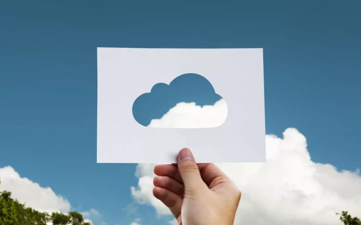 Cloud paper cutout against blue skies