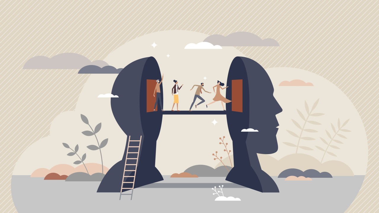 An illustration of a head split in two. A ladder leading up one-half, with a bridge connecting to the other half and people crossing the bridge.